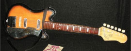 Tin toy guitar